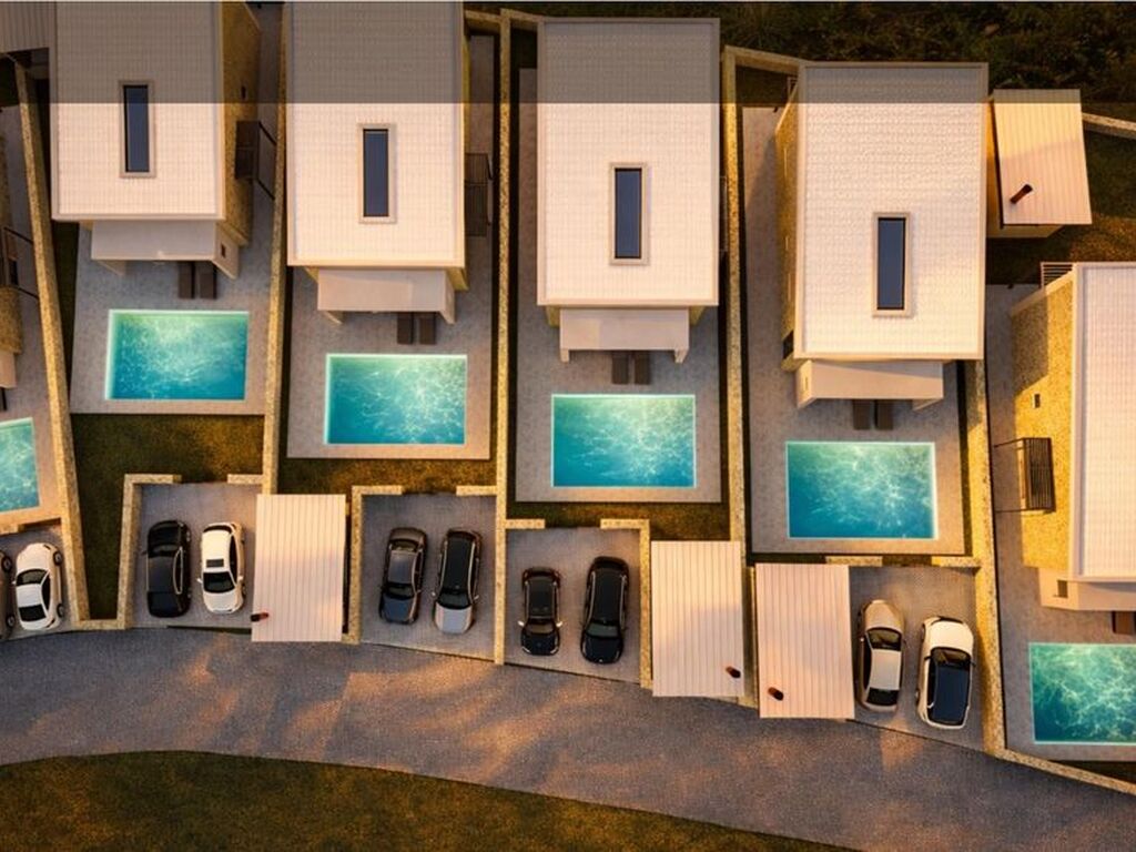 Pasha Villas natural stone facade at dusk — new build villa, Trikorfo, Parga, Greece